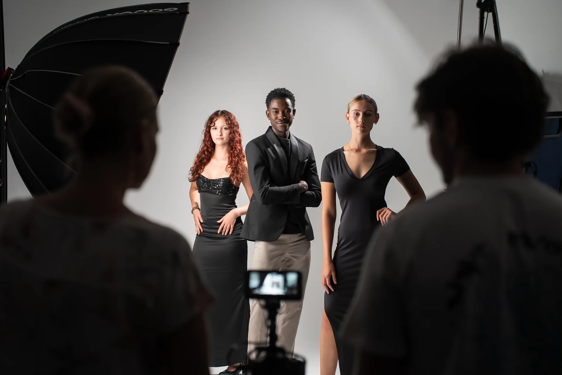 A multi-person production being photographed inside Studio GQ